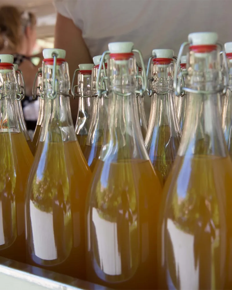 Pre-batched bottled cocktails ready for a large reception